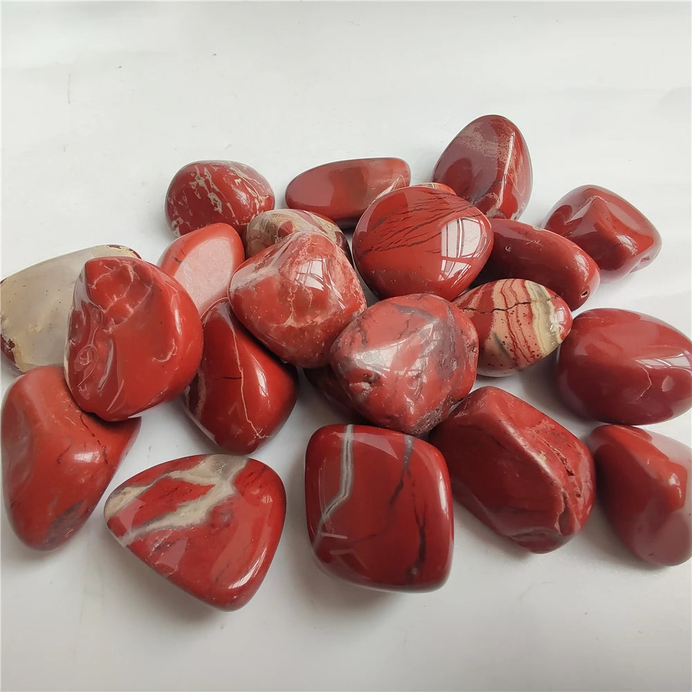 Red marbled stones on a white background