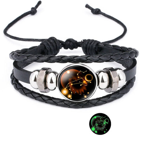 Black braided leather bracelet with silver accents and a glowing pendant on a white background