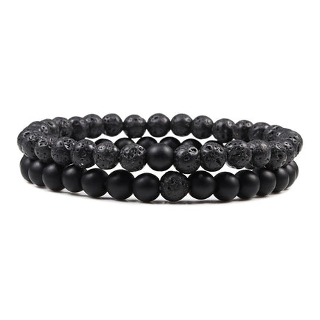 Two black beaded bracelets on a white background