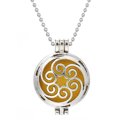 Round pendant with gold design and silver chain on white background