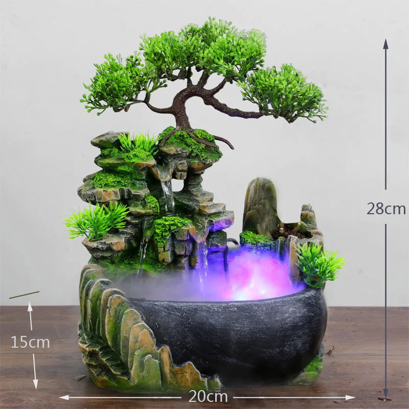 Decorative water fountain with bonsai tree and mossy rocks on a wooden surface.