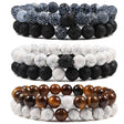 Set of three beaded bracelets with different color schemes on a white background