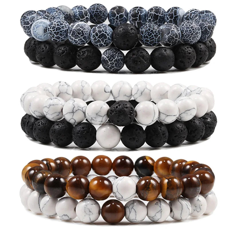 Set of three beaded bracelets with different color schemes on a white background