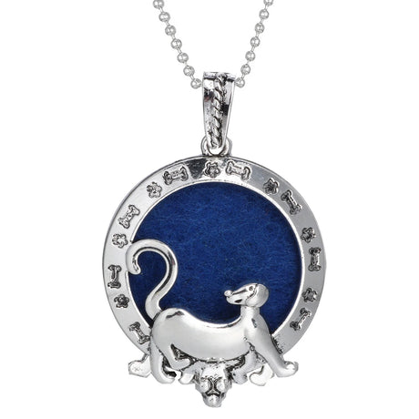 Silver pendant with a blue circle and dog design on a white background