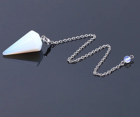 Necklace with a white pendant on a dark background