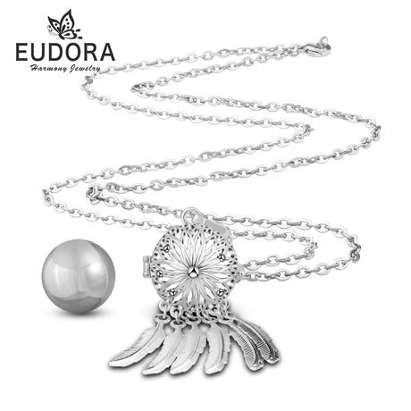 Silver necklace with a detailed pendant and pearl, branded as Eudora on a white background.