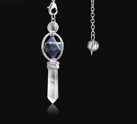 Crystal pendant necklace with silver chain on a black background