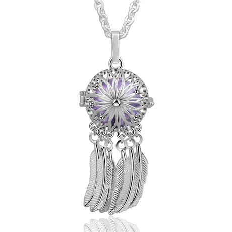 Silver necklace with a purple gemstone and feather pendants on a white background