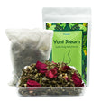 Yoni steam product with packaging and ingredients on a white background
