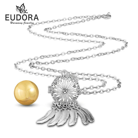 Silver necklace with a decorative pendant and gold sphere on a white background, featuring the Eudora brand.
