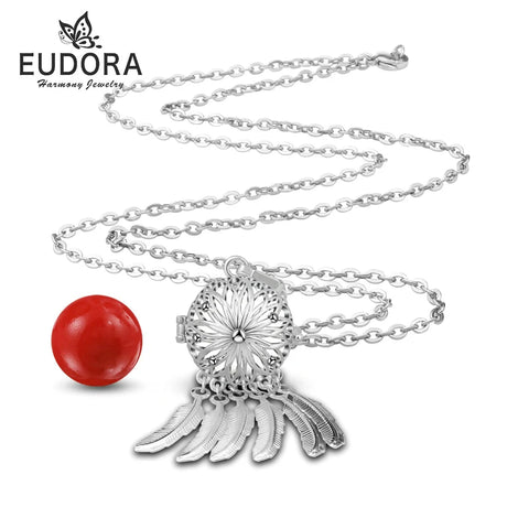 Silver necklace with red pendant on a white background, featuring Eudora brand.