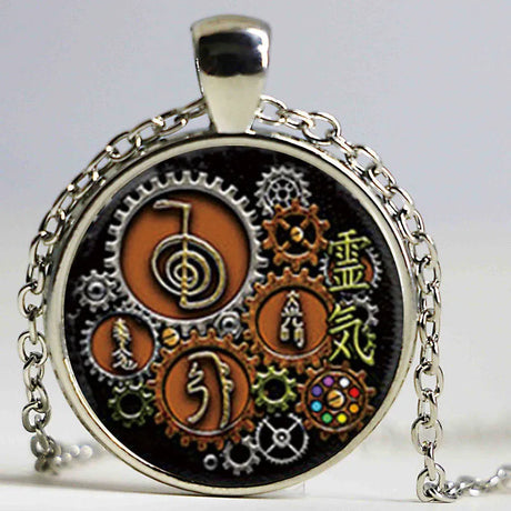 Necklace with a circular pendant featuring gears and symbols on a black background