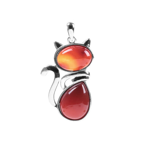 Cat-shaped pendant with red and orange stones on a white background