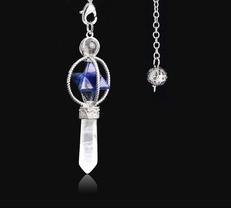 Jewelry pendant with blue gemstone and crystal on a black background
