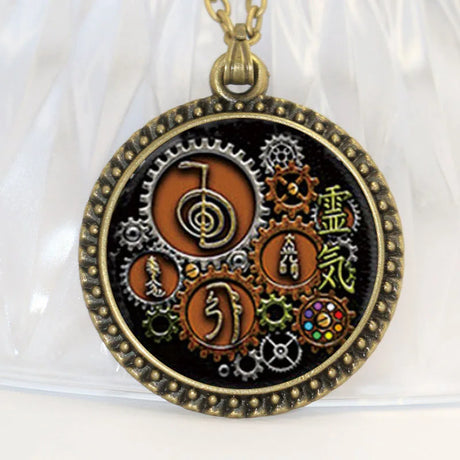 Necklace with a round pendant featuring gears and symbols on a white background