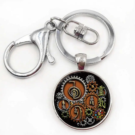 Keychain with circular design featuring symbols and text on a white background