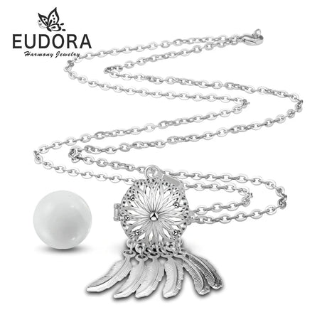 Silver necklace with a decorative pendant and pearl on a white background, featuring the Eudora brand.