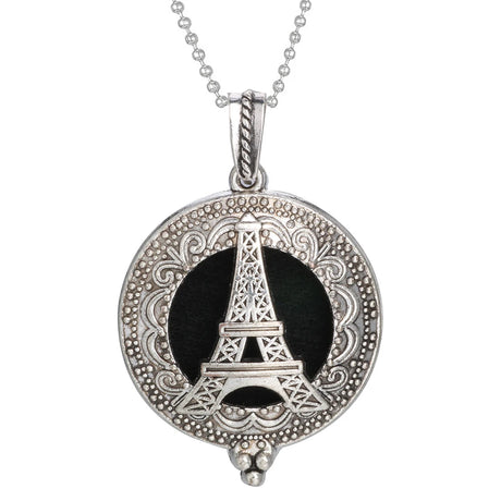 Silver pendant with Eiffel Tower design on a white background