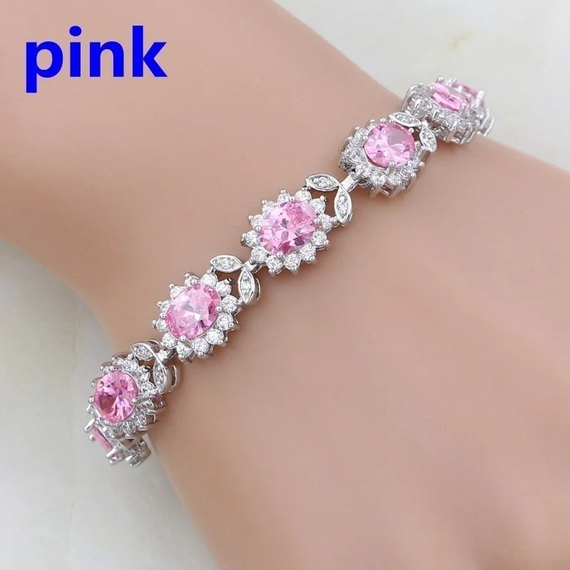 Pink gemstone bracelet on a mannequin arm with 'pink' text above.