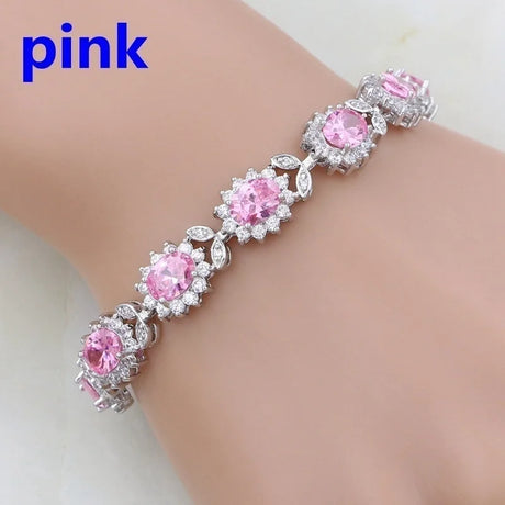 Pink gemstone bracelet on a mannequin arm with 'pink' text above.