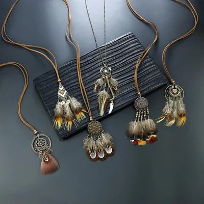 Feathered necklaces with tassels on a textured surface