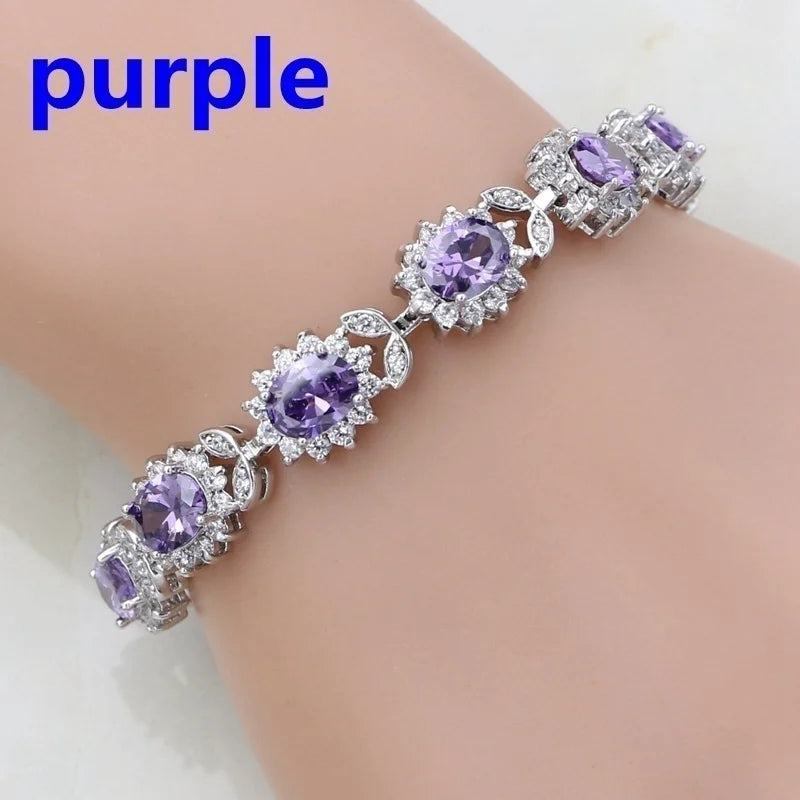 Purple gemstone bracelet on a mannequin arm with 'purple' text above.