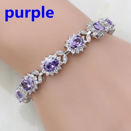 Purple gemstone bracelet on a mannequin arm with 'purple' text above.