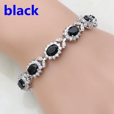 Black gemstone bracelet on a wrist with 'black' text above.