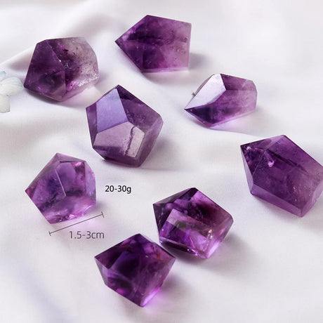 Purple crystal stones on a white background with measurements indicated.