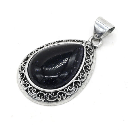 Silver pendant with a black teardrop-shaped gemstone on a white background
