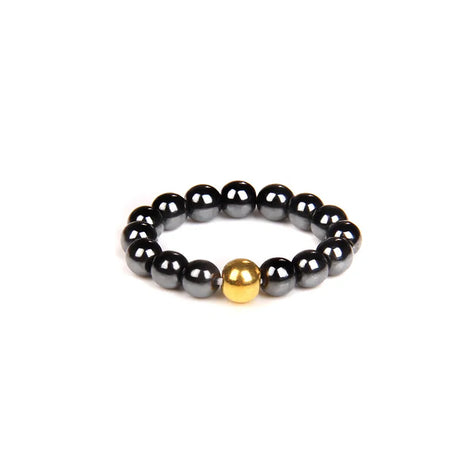 Black beaded bracelet with a gold accent on a white background