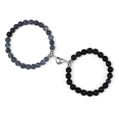 Two black beaded bracelets on a white background