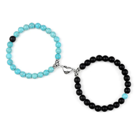Two beaded bracelets, one turquoise and one black, on a white background.