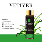 Maxim Vetiver essential oil bottle with grass on a white background