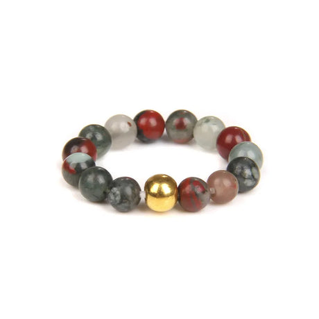 Multicolored beaded bracelet with a gold bead on a white background