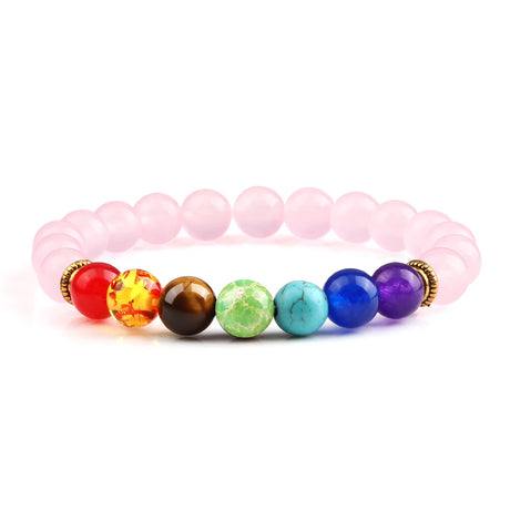 Colorful beaded bracelet with pink elastic band on a white background
