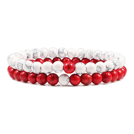 Two beaded bracelets with red and white beads on a white background