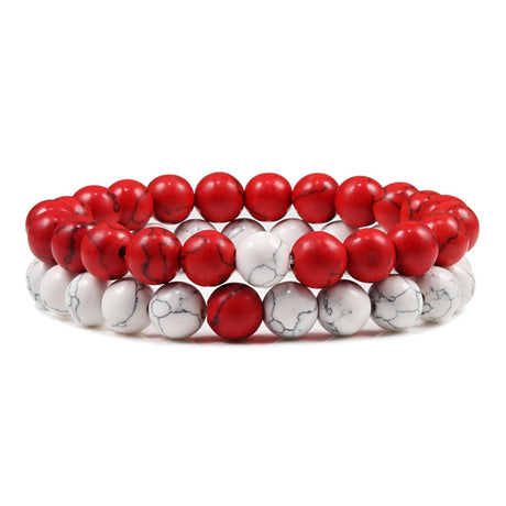 Two beaded bracelets, one red and one with white marbled pattern, on a white background.
