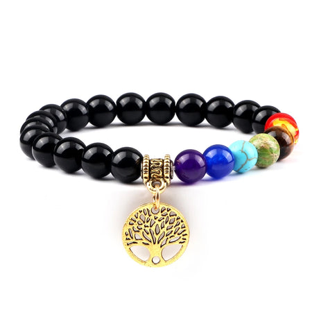 Black beaded bracelet with colorful beads and a gold tree of life charm on a white background