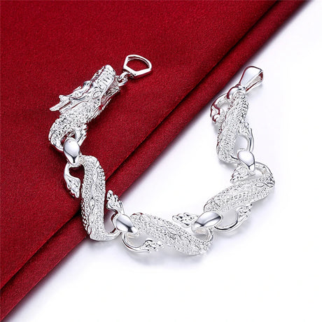 Silver bracelet on a red and white background