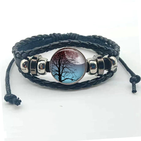 Bracelet with tree and moon design on a white background