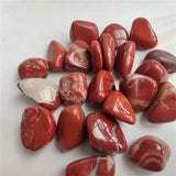 Collection of red marbled stones on a white background