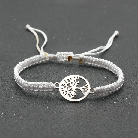 Bracelet with a tree of life charm on a dark background