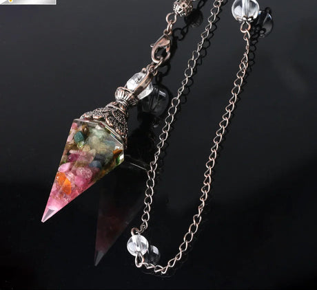 Crystal pendant necklace with chain on a black background