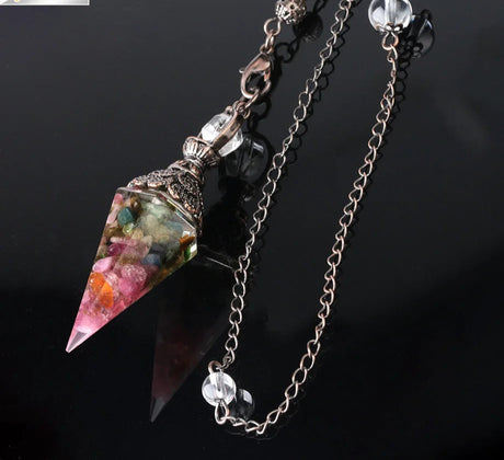 Crystal pendant necklace with chain on a black background