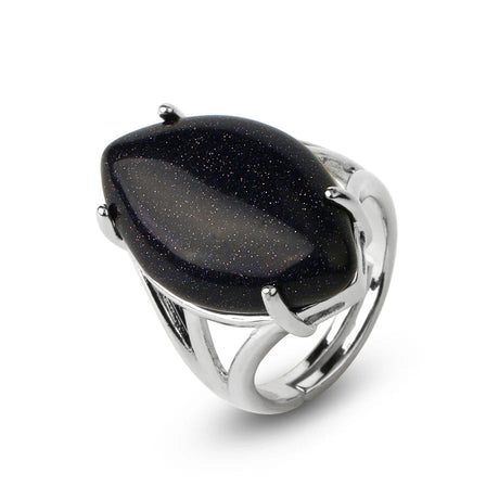 Silver ring with a large black stone on a white background