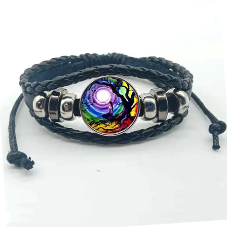 Bracelet with a colorful bead and braided black cord on a white background