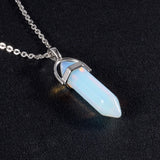 Necklace with a blue pendant on a black background