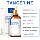 Tangerine essential oil bottle with dropper and packaging on a white background