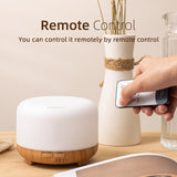 White and wooden diffuser with remote control on a table